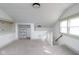 Open and bright bonus room with neutral carpet, white walls, storage and staircase at 1515 Dawson St, Indianapolis, IN 46203