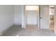 Bright bedroom featuring neutral carpet, white walls and trim, and an open closet at 1515 Dawson St, Indianapolis, IN 46203