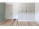 Bedroom with closet space, wainscoting and hardwood flooring at 1515 Dawson St, Indianapolis, IN 46203