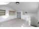 A spacious bonus room offers storage and natural light from the skylight and updated flooring at 1515 Dawson St, Indianapolis, IN 46203