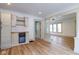 Bright living room featuring hardwood floors, a built in beverage cooler, and white trim at 1515 Dawson St, Indianapolis, IN 46203