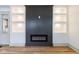 Living room fireplace with detailed shelving, recessed lighting, and a modern electric fireplace at 1515 Dawson St, Indianapolis, IN 46203