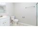 Clean and simple bathroom design featuring a shower, toilet, and vanity sink at 1528 N Dukane Way, Indianapolis, IN 46214