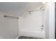 Bathroom featuring a white tiled shower-tub and stainless steel hardware at 1528 N Dukane Way, Indianapolis, IN 46214