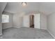 Bedroom with neutral walls, neutral carpet, and a double door closet at 1528 N Dukane Way, Indianapolis, IN 46214