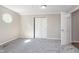 Bedroom with neutral walls, neutral carpet, and a double door closet at 1528 N Dukane Way, Indianapolis, IN 46214