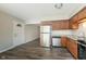 Clean kitchen with stainless steel appliances and ample cabinets at 1528 N Dukane Way, Indianapolis, IN 46214
