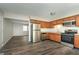Bright kitchen features stainless steel appliances, modern flooring, and ample counter space at 1528 N Dukane Way, Indianapolis, IN 46214
