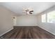 Spacious living room featuring modern flooring, ceiling fan, and ample natural light at 1528 N Dukane Way, Indianapolis, IN 46214