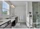 Modern bathroom featuring double vanities, a walk-in shower, and natural light, creating a spa-like retreat in your home at 16060 Barringer Ct, Westfield, IN 46074