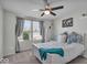 Bright bedroom with a ceiling fan, large windows, and calming blue accents at 16060 Barringer Ct, Westfield, IN 46074