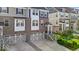 Street view of modern townhomes with brick accents, individual garages, and inviting curb appeal at 16060 Barringer Ct, Westfield, IN 46074