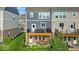 Rear exterior view highlights the decks, patios, and outdoor living spaces of the townhomes at 16060 Barringer Ct, Westfield, IN 46074