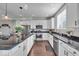 Modern kitchen with white cabinetry, granite countertops, stainless steel appliances, and an island at 16060 Barringer Ct, Westfield, IN 46074
