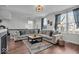 Cozy living room showcasing a large sectional, contemporary lighting, and comfortable decor at 16060 Barringer Ct, Westfield, IN 46074