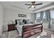 Cozy main bedroom with tray ceiling, neutral colors, and large windows that flood the room with natural light at 16060 Barringer Ct, Westfield, IN 46074
