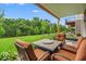 Outdoor patio has a seating arrangement with manicured landscaping and green trees at 16060 Barringer Ct, Westfield, IN 46074