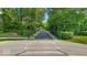Tree-lined street view, showcasing the peaceful surroundings of the neighborhood at 16060 Barringer Ct, Westfield, IN 46074