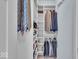 Organized walk-in closet with custom shelving and hanging racks for efficient storage at 16060 Barringer Ct, Westfield, IN 46074