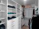 Bright walk-in closet with custom shelving and drawers providing ample storage at 16060 Barringer Ct, Westfield, IN 46074