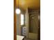Cozy bathroom featuring a shower with yellow surround, yellow accents and ample natural light at 1700 S Perdieu Rd, Muncie, IN 47302