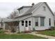 Charming home with a gable roof, gray siding, and well-maintained landscaping, offering classic appeal at 1700 S Perdieu Rd, Muncie, IN 47302