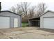 View of the detached garage and carport, providing ample storage for vehicles and equipment at 1700 S Perdieu Rd, Muncie, IN 47302