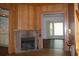 Living room featuring a brick fireplace with hardwood floors at 1700 S Perdieu Rd, Muncie, IN 47302