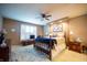 Spacious bedroom with a ceiling fan, plush carpet, and ample natural light from the windows at 172 Arabian Ct, Whiteland, IN 46184