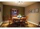 Traditional dining area with a dark wood table, hutch, and decorative rug at 172 Arabian Ct, Whiteland, IN 46184