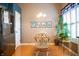 Bright dining area with hardwood floors, stylish lighting, and a stainless steel refrigerator at 172 Arabian Ct, Whiteland, IN 46184