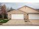 Two-car attached garage with brick facade and white doors offers ample parking and curb appeal at 172 Arabian Ct, Whiteland, IN 46184