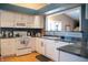 Well-lit kitchen with white cabinetry, modern appliances, and a functional open layout at 172 Arabian Ct, Whiteland, IN 46184
