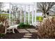 Beautiful garden featuring white benches, stepping stone pathway, and a variety of blooming flowers at 172 Arabian Ct, Whiteland, IN 46184