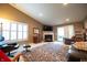 Spacious living room with vaulted ceilings, fireplace, plush carpet, and ample natural light at 172 Arabian Ct, Whiteland, IN 46184