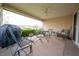 Relaxing covered patio with ceiling fan and comfortable seating, ideal for outdoor enjoyment at 172 Arabian Ct, Whiteland, IN 46184