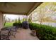 Inviting covered patio with outdoor furniture and scenic views of the pond and well-maintained landscaping at 172 Arabian Ct, Whiteland, IN 46184