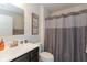 Bathroom showcasing a vanity with dark cabinets, a mirror, and a shower with curtain at 181 Kiawah Dr, Whiteland, IN 46184