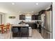 Stylish kitchen with granite countertops, stainless steel appliances, and a breakfast bar at 181 Kiawah Dr, Whiteland, IN 46184