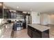 Kitchen features granite countertops, stainless steel appliances, and a functional kitchen island at 181 Kiawah Dr, Whiteland, IN 46184