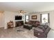 Cozy living room with a modern ceiling fan, a large TV, and comfortable seating at 181 Kiawah Dr, Whiteland, IN 46184