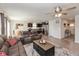 Spacious living area featuring an open floor plan with dark kitchen and stainless appliances at 181 Kiawah Dr, Whiteland, IN 46184