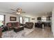 Open-concept living area with dark kitchen cabinets and comfortable leather sofas at 181 Kiawah Dr, Whiteland, IN 46184