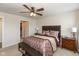 Relaxing bedroom with a ceiling fan, carpeted floor, and neutral décor at 181 Kiawah Dr, Whiteland, IN 46184