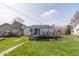 Yard with a wooden deck and green grass at 218 Illinois St, Shirley, IN 47384