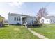 Exterior photo of the house and backyard with a wooden deck at 218 Illinois St, Shirley, IN 47384