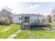 View of backyard featuring a deck and sliding glass doors to the house at 218 Illinois St, Shirley, IN 47384