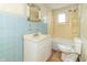 Modest bathroom features blue tile, a standard sink, and a combined shower and bathtub at 218 Illinois St, Shirley, IN 47384