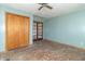 Bedroom with light blue walls, hardwood floors, closet, and French doors leading to another room at 218 Illinois St, Shirley, IN 47384