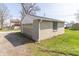 View of detached garage with white door at 218 Illinois St, Shirley, IN 47384
